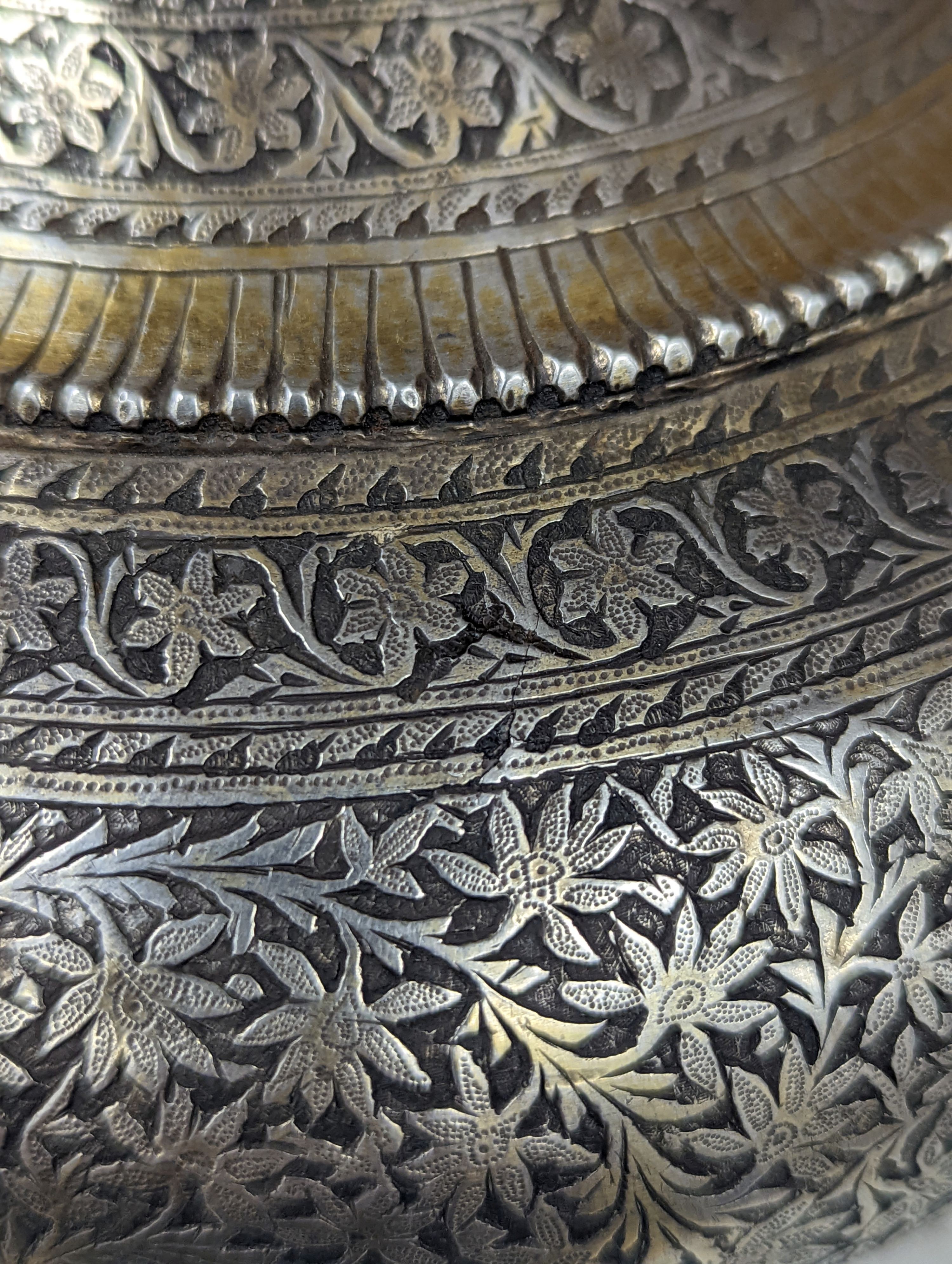 A 19th century North Indian silver surahi with engraved shawl decoration 30cm